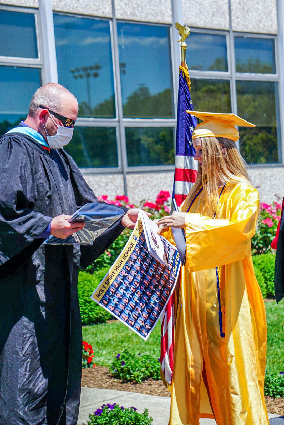 Holy Spirit drive-through diploma pickup